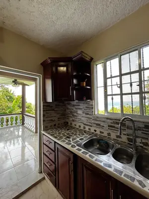 a kitchen with a sink and a window in it at Casa Vista Mar, Los Patos, Barahona - 4x4 or All Terrain Vehicle to Access Property in Los Patos