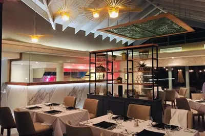 a dining room with white tables and chairs at Select Sosua Adults Only, Trademark by Wyndham All Inclusive in Sosúa