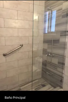 a shower with a glass door in a bathroom at Cadaqués, Bayahibe, República Dominicana in Bayahibe