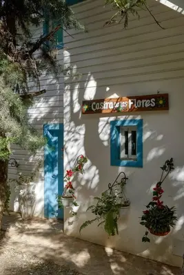 a building with plants on the side of it at New-CasitaDeLasFlores-View-Wifi-Jacuzzi-Jarabacoa in Jarabacoa