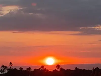 a sunset with the sun in the sky at 1BR Suite at Villa Costa Verde near Playa Cofresi, Puerto Plata, with a pool, balcony and a rooftop terrace in San Felipe de Puerto Plata