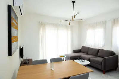a living room with a couch and a table at Apartahotel Señorial in Higuey