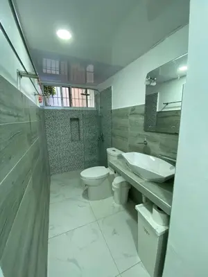 a bathroom with a toilet and a sink at 2 BR & 1WR Suite at Villa Costa Verde near Playa Cofresi, Puerto Plata with a pool, balcony, and a rooftop terrace in San Felipe de Puerto Plata