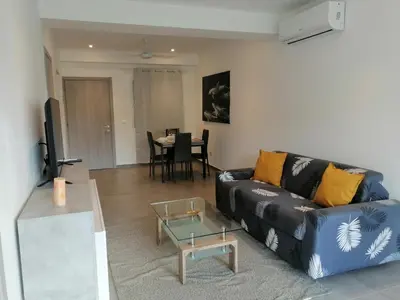 a living room with a couch and a table at Sabrina Plaza Residence in Las Terrenas