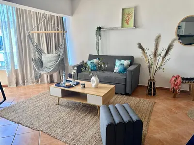 a living room with a couch and a coffee table at Apartamento ll Vista al Mar Albatros BY JU Juan Dolio in Juan Dolio
