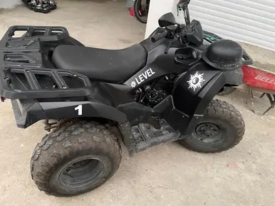 a black four wheeler parked in a garage at LEVEL suites premium in Sosúa