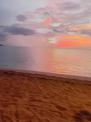 a view of the beach with a sunset at La casita del sol in Las Terrenas