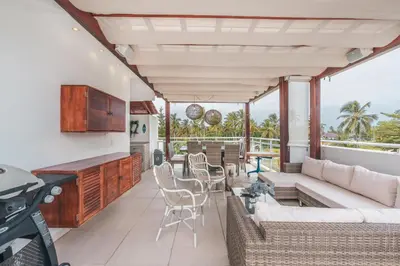 a living room with a couch and a table at Unique gem penthouse in playa bonita in Las Terrenas
