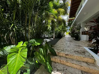 a garden with plants and stairs in a house at Vista Bayahibe Paradise in Bayahibe