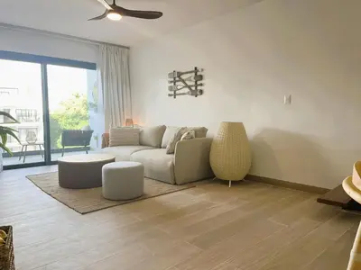 a living room with a couch and a table at Exclusivo penthouse con piscina en Playa Bávaro in Punta Cana
