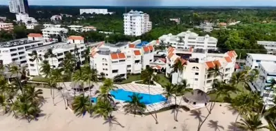 an aerial view of the resort with the beach and buildings at Apartamento l Vista al Mar Albatros BY JU Juan Dolio in Juan Dolio