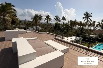 a view from the balcony of a villa with palm trees at Villa BALBOA - Las Terrenas - Punta Bonita in Las Terrenas