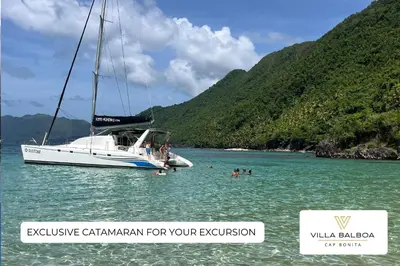 a boat in the water with people in the water at Villa BALBOA - Las Terrenas - Punta Bonita in Las Terrenas