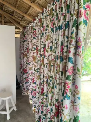 a curtain with flowers on it in a room at EL Cielo de Cana in Las Terrenas