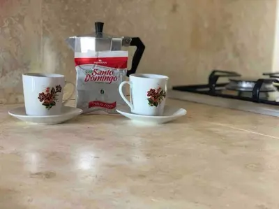 two coffee cups sitting on top of a counter at Ballenas beach C8 in Las Terrenas