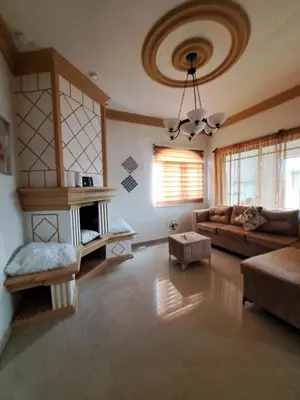 a living room with a couch and a table at Cerca del divino niño I WiFi I TV in Constanza