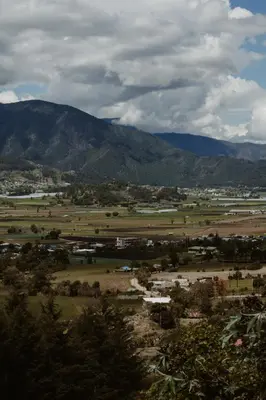 a view of a field with mountains in the background at Cerca del divino niño I WiFi I TV in Constanza