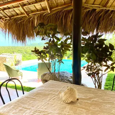a table with a shell sitting on top of a table at Casa Del Sol in El Limón