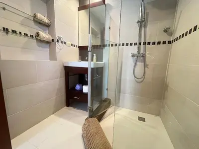 a bathroom with a glass shower and a sink at Cozy 2 bed apartment garden views close to Playa Bavaro in Punta Cana