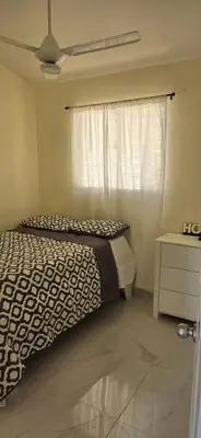 a bedroom with a bed and a window at Villa el real los patos in Los Patos