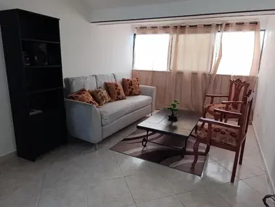 a living room with a couch and a table at Acuario residencial 1 in La Viva