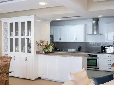 a kitchen with white cabinets and a counter top at SuiteDelux Oceanview Marbella 3BDR in Juan Pedro