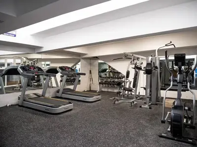 a gym with several tread machines in a room at SuiteDelux Oceanview Marbella 3BDR in Juan Pedro