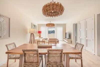 a dining room with a table and chairs at Exceptional apartment nearby beach at Portillo in Las Terrenas