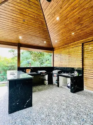 a large room with a wooden ceiling and desks at Río Privado Villa Jarabacoa con Picuzzi in Jarabacoa