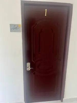 a black door with the number one on it at Departamento Sol in Santo Domingo