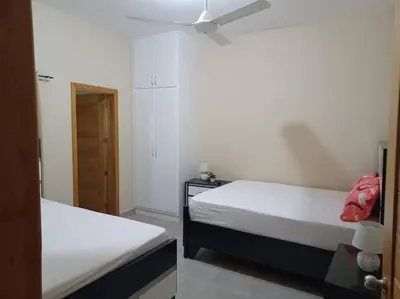 a bedroom with two beds and a ceiling fan at Villa Xiomara in El Jamo