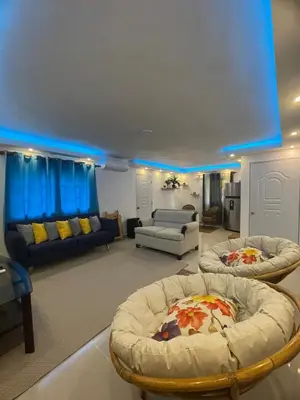 a large living room with two couches and chairs at Villa El cocotero in La Joya