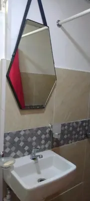 a bathroom with a sink and a mirror at Apartamento en la Zona Colonial in Santo Domingo