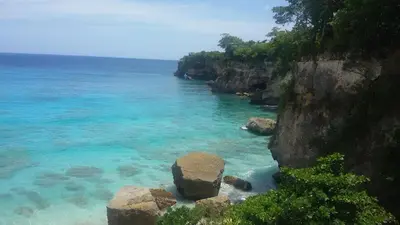 a view of a beach with rocks in the water at B&B El Mirador al Mar in Sosúa
