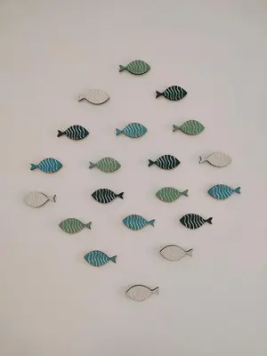 a group of fish on a white wall at Estrella Dominicus - Excepcional Apartamento en el Caribe in Bayahibe
