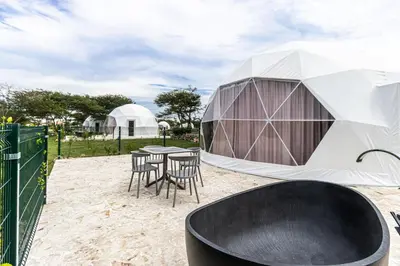 a gazebo with a table and chairs in a yard at Parque Acuático - Sosua! in Laguna del Higüero