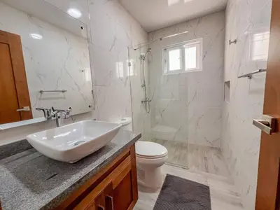 a bathroom with a sink and a toilet and a shower at New 2BR APT in Sosua town, close to strip and next to supermarket in Sosúa