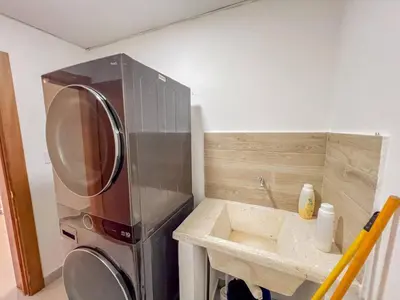 a kitchen with a sink and a washing machine at New 2BR APT in Sosua town, close to strip and next to supermarket in Sosúa