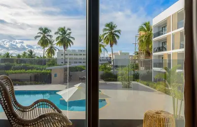 a view of a swimming pool from a window at New pool views Sausalito Residencial close to Playa Bavaro in Punta Cana