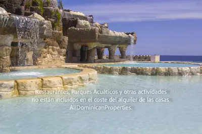 a water fountain in the middle of a body of water at Villas Santa Fe in Sosúa