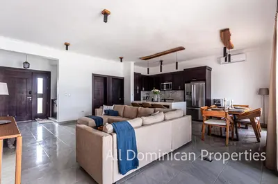a living room with a couch and a table at Villas Santa Fe in Sosúa