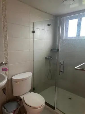 a bathroom with a toilet and a glass shower at Apartamento con Deslumbrante Vista Al Mar in La Francia