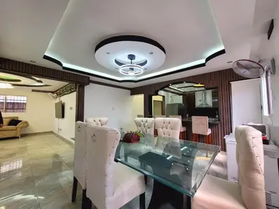 a dining room with a glass table and white chairs at Aparta hoteles Corales del Sur in La Viva