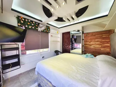 a bedroom with a large bed in a room at Aparta hoteles Corales del Sur in La Viva