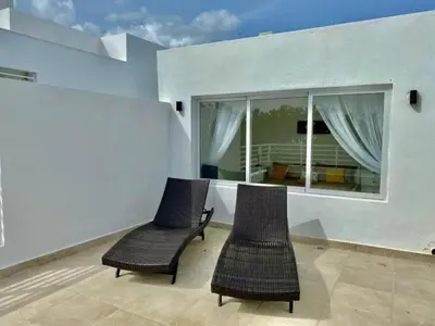 two chairs in a room with a window at Estrella del caribe in La Laguna