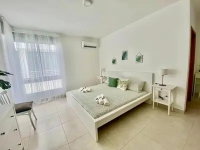 a bedroom with a bed with two stuffed animals on it at apartamento luxury in La Laguna