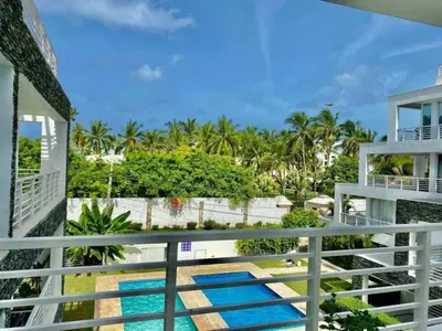 a balcony view of a resort with two pools at apartamento luxury in La Laguna