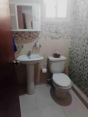 a bathroom with a toilet and a sink at La maravilla y comodidad al máximo in La Javilla