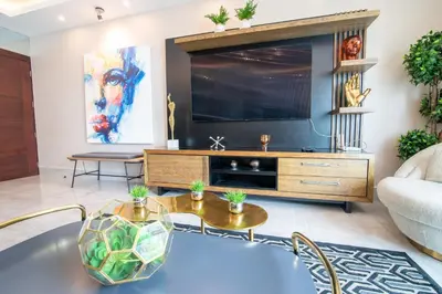 a living room with a large flat screen tv at Exclusivo apartamento - Soha Suites II-B9 - 2 BR in Rincón Largo