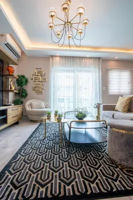 a living room with a chandelier and a rug at Exclusivo apartamento - Soha Suites II-B9 - 2 BR in Rincón Largo